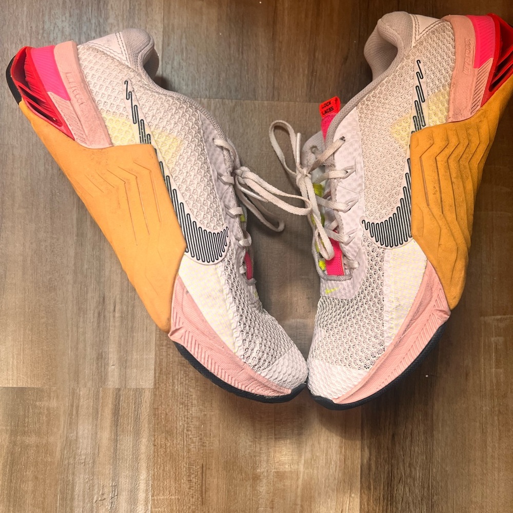 White Nike sneakers. great for Leg Days and Sprinting